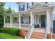 Inviting front porch featuring classic columns and ample seating, perfect for relaxation at 101 Ironcreek Pl, Apex, NC 27539