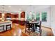 Kitchen with island that flows into a breakfast nook featuring a large bay window with natural light at 101 Ironcreek Pl, Apex, NC 27539