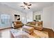 Cozy living room with comfortable couches, patterned rug, and bright natural light at 101 Ironcreek Pl, Apex, NC 27539