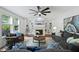 Bright living room with built-in bookshelves, a fireplace, and comfortable seating at 101 Ironcreek Pl, Apex, NC 27539