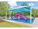 Vibrant community playground with slides, climbing structures, and shaded seating at 101 Ironcreek Pl, Apex, NC 27539