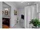 Bathroom with black and white tile, vintage fixtures, and access to a shower and sink at 1015 Watts St, Durham, NC 27701