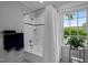 Bright bathroom with tiled shower, and neutral colors at 1015 Watts St, Durham, NC 27701