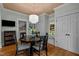Charming breakfast nook with hardwood floors, a built-in bench, and a view of the backyard at 1015 Watts St, Durham, NC 27701