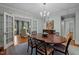 Elegant dining room with hardwood floors, a chandelier, and a large oval dining table at 1015 Watts St, Durham, NC 27701