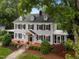 Lovely two-story house with well-maintained landscaping and a screened porch at 1015 Watts St, Durham, NC 27701