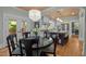 Bright eat-in kitchen with white cabinetry, a butcher block island, and stainless steel appliances at 1015 Watts St, Durham, NC 27701