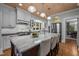 Gourmet kitchen with white cabinets, stainless steel appliances, and an oversized butcher block island at 1015 Watts St, Durham, NC 27701