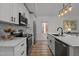 Stylish kitchen with white countertops, stainless steel appliances, and modern lighting fixtures at 1015 Watts St, Durham, NC 27701