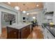 Open kitchen featuring butcher block island with dining and white cabinetry with stainless steel appliances at 1015 Watts St, Durham, NC 27701