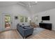 Inviting living room with wood floors, contemporary furnishings, and a view of the outdoors at 1015 Watts St, Durham, NC 27701