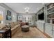 Cozy Gathering room featuring built-in shelves, comfortable seating, and natural light at 1015 Watts St, Durham, NC 27701