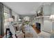 Open living space with hardwood floors, fireplace, neutral decor, and access to multiple rooms at 1015 Watts St, Durham, NC 27701