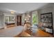 Spacious home office featuring hardwood floors and natural light from multiple windows at 1015 Watts St, Durham, NC 27701