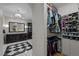 Walk-in closet featuring custom shelving, organization system, and ample storage space at 1015 Watts St, Durham, NC 27701