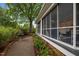 Exterior shot of the screened porch with a walkway and fountain at 1015 Watts St, Durham, NC 27701