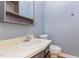 Cozy bathroom features a single sink vanity with mirror and toilet at 105 Houston Cir, Cary, NC 27513