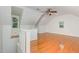 Spacious bonus room features hardwood floors, vaulted ceilings, and natural light at 105 Houston Cir, Cary, NC 27513