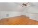 Bright bonus room featuring hardwood floors, neutral paint, and dormer windows at 105 Houston Cir, Cary, NC 27513