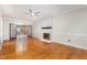 Inviting living room with hardwood floors, fireplace, and view to the screened-in porch at 105 Houston Cir, Cary, NC 27513