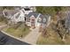 Aerial view of a brick home with attached garage and long driveway at 105 Stoney Dr, Durham, NC 27703