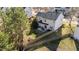 Aerial view of a backyard with a patio, fire pit, and lawn at 105 Stoney Dr, Durham, NC 27703