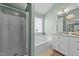Bright bathroom boasts a double sink vanity, a shower, and a soaking tub at 105 Stoney Dr, Durham, NC 27703