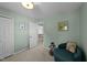 Comfortable bedroom with neutral-colored walls, round chair, and open doorway, creating a serene space at 105 Stoney Dr, Durham, NC 27703