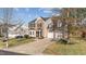 Attractive home with a two-car garage, manicured lawn, and a welcoming entrance at 105 Stoney Dr, Durham, NC 27703