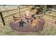 Cozy backyard fire pit with Adirondack chairs and mulch at 105 Stoney Dr, Durham, NC 27703