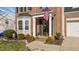 Charming brick home featuring an inviting front porch with plants at 105 Stoney Dr, Durham, NC 27703