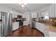 Modern kitchen with stainless steel appliances, white cabinets, and stylish backsplash at 105 Stoney Dr, Durham, NC 27703