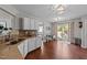 Open eat-in kitchen with granite counters, white cabinets, and access to the outdoor patio area at 105 Stoney Dr, Durham, NC 27703