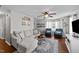 Bright living room featuring a comfortable sofa, accent chairs, and natural light at 105 Stoney Dr, Durham, NC 27703
