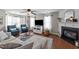 Inviting living room showcases a fireplace, comfortable seating, and a stylish ceiling fan at 105 Stoney Dr, Durham, NC 27703