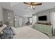 Bright main bedroom with decorative ceiling fan, lots of natural light, and neutral decor at 105 Stoney Dr, Durham, NC 27703