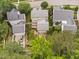 An aerial view of a home showcasing the manicured backyard, deck, and neighborhood at 10516 Cokesbury Ln, Raleigh, NC 27614