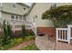 Landscaped backyard featuring a stone path, mature trees, and a well-maintained lawn at 10516 Cokesbury Ln, Raleigh, NC 27614