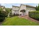 Inviting backyard with tiered deck, mature landscaping, and a charming fence at 10516 Cokesbury Ln, Raleigh, NC 27614