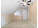Bright upstairs bedroom with carpet and an angled window and a ceiling fan at 10516 Cokesbury Ln, Raleigh, NC 27614