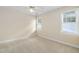 Bedroom with carpeted floor, a ceiling fan, and bright windows at 10516 Cokesbury Ln, Raleigh, NC 27614