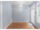 Bright dining room with modern lighting and an access door to the outdoor patio at 10516 Cokesbury Ln, Raleigh, NC 27614