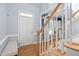 Bright foyer featuring hardwood floors, staircase, and natural light at 10516 Cokesbury Ln, Raleigh, NC 27614