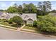 Charming home with tidy front yard, manicured landscaping, and welcoming curb appeal at 10516 Cokesbury Ln, Raleigh, NC 27614