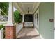 Relaxing front porch with a white swing, offering a comfortable outdoor space at 10516 Cokesbury Ln, Raleigh, NC 27614