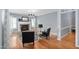 Cozy living room featuring a fireplace, hardwood floors, and stylish furnishings at 10516 Cokesbury Ln, Raleigh, NC 27614