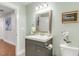 Well-lit bathroom with a vanity, framed mirror, and modern fixtures at 106 E Delafield Ave, Durham, NC 27704