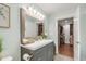 This bathroom offers a double sink, and a view into a walk-in closet at 106 E Delafield Ave, Durham, NC 27704