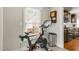 Small exercise area with a stationary bike and wood clock at 106 E Delafield Ave, Durham, NC 27704