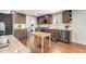 Bright kitchen with stainless appliances, hardwood floors and custom cabinets at 106 E Delafield Ave, Durham, NC 27704